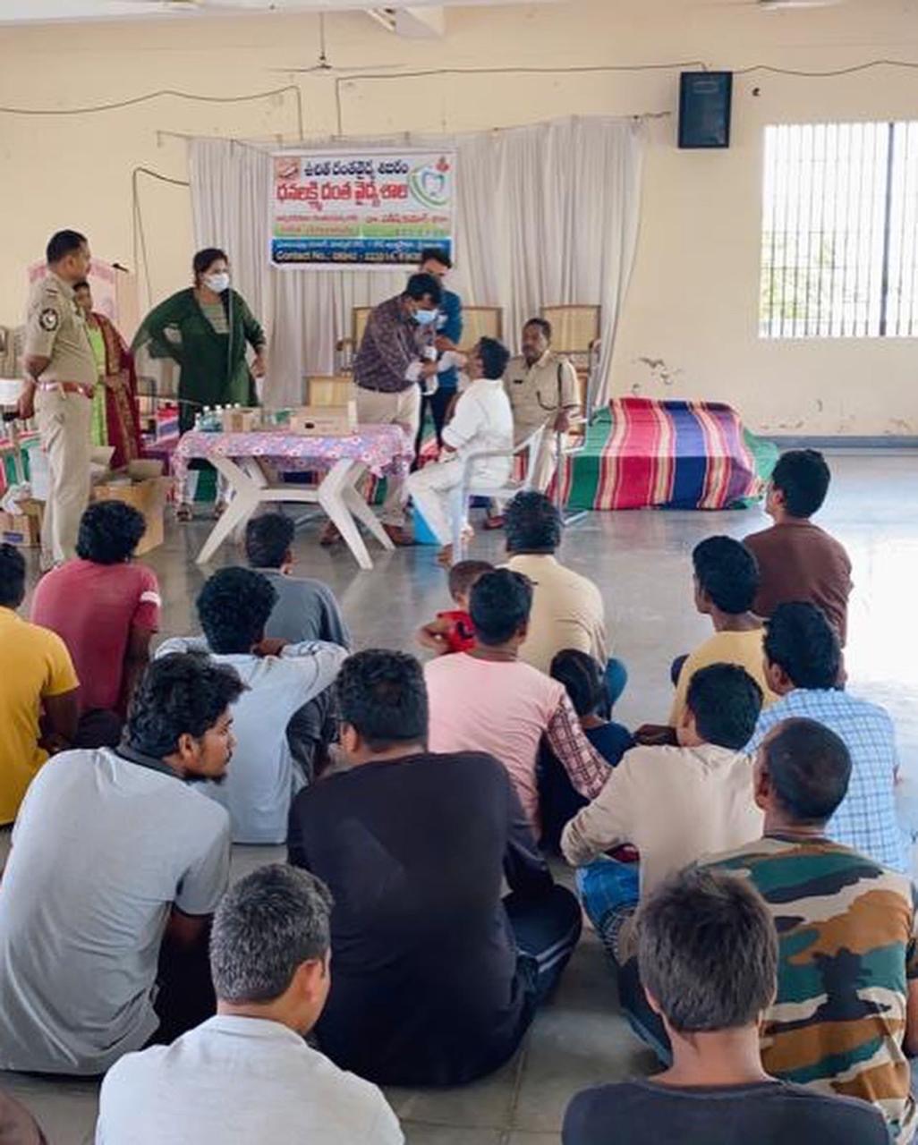 Dr. Satish conducting free dental checkup screening for patients