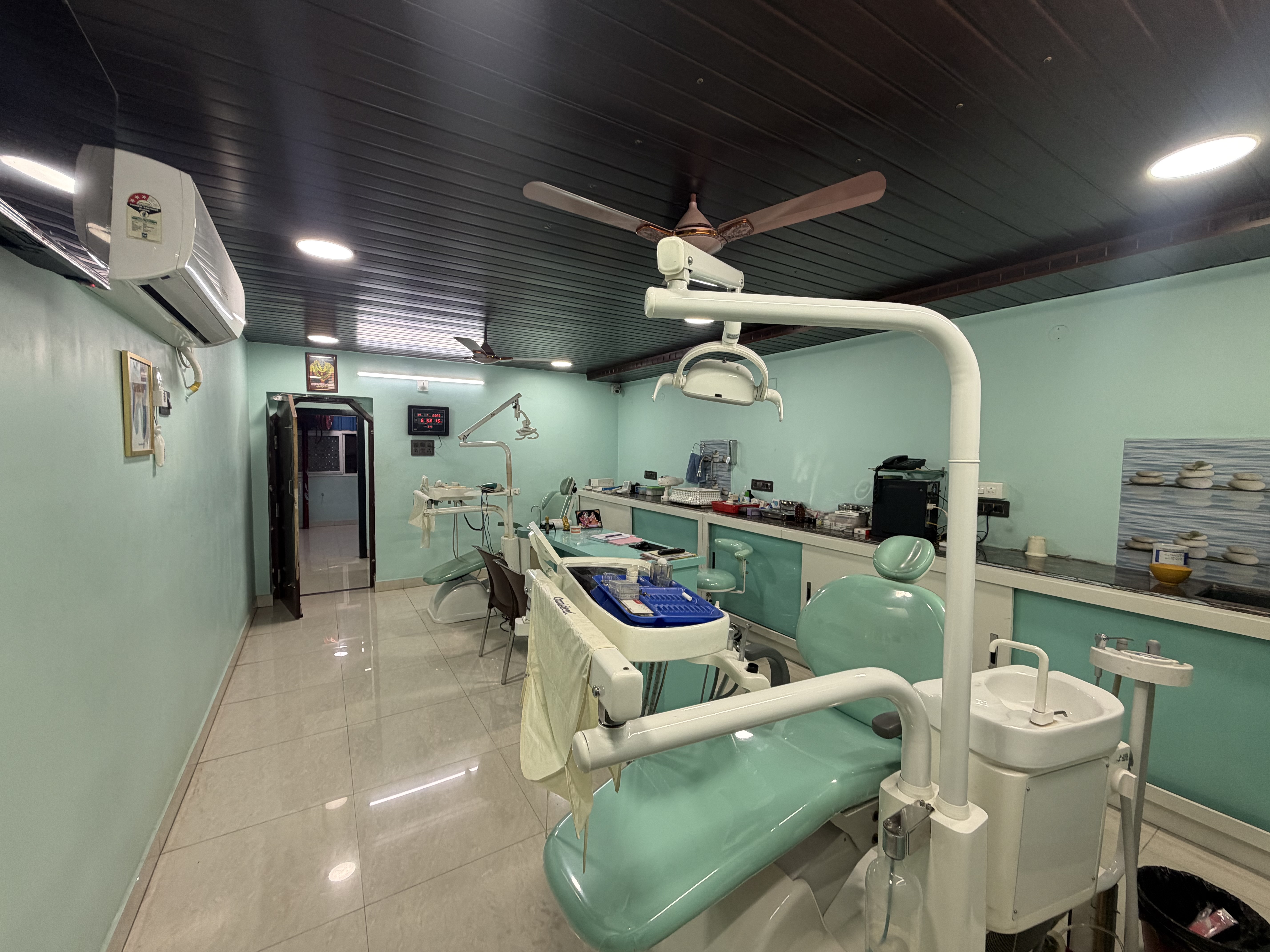 Modern dental operatory room with dual chair setups at Dhanalakshmi Dental Clinic Srikakulam